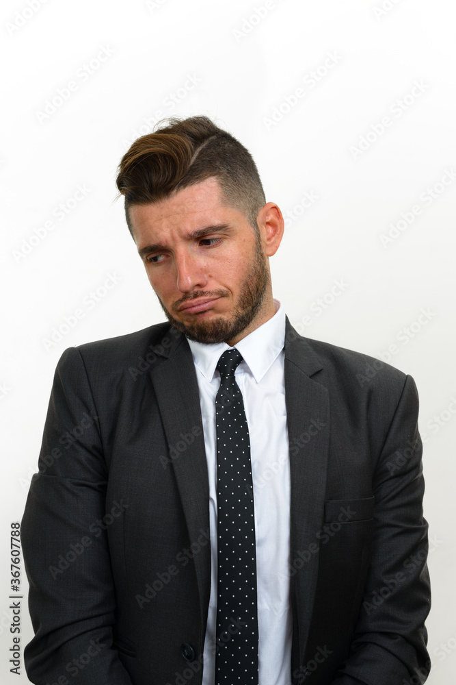 Portrait of handsome bearded Hispanic businessman in suit Portrait of handsome bearded Hispanic businessman in suit