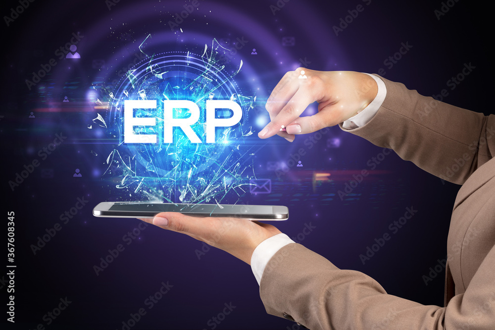 Close-up of a touchscreen with ERP abbreviation, modern technology concept Close-up of a touchscreen with ERP abbreviation, modern technology concept