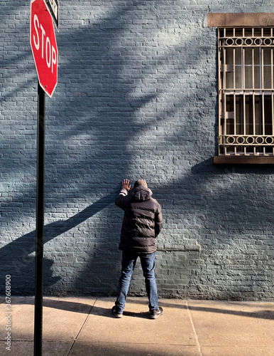 Man Peeing on Wall
