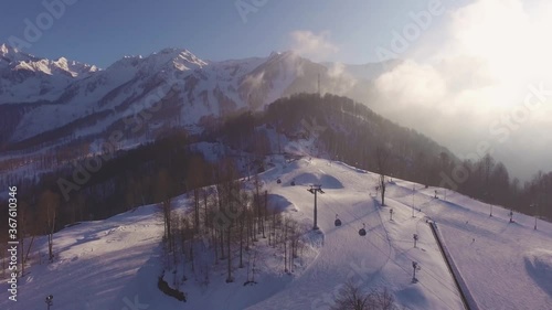 Mountain winter snow resort on a sunny day filmed with a drone photo