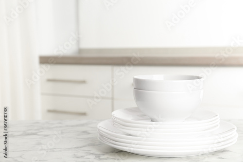 Wallpaper Mural Stack of clean plates and bowls on marble table in kitchen. Space for text Torontodigital.ca
