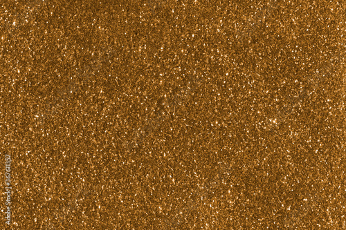 Luxury gold glitter textures with bright sparkles and flickers. Shiny glamour background.