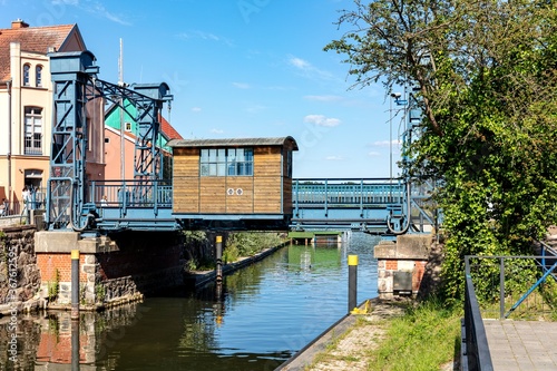 Lift bridge in Plau am See, Germany. It is a steel lift bridge that was built in 1916. With a lifting height of up to 1.86 m, it is the highest lifting bridge in Mecklenburg. photo