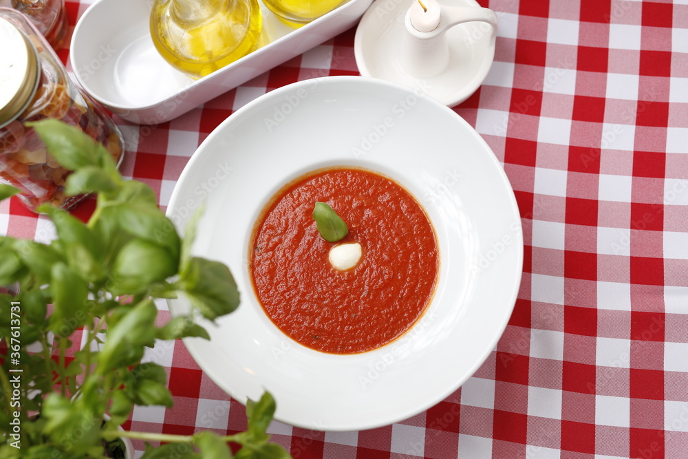 Tomato soup with basil and cream.
Suggestion to serve a dish. Food background.
Tomato soup with basil and cream.
Suggestion to serve a dish. Food background.