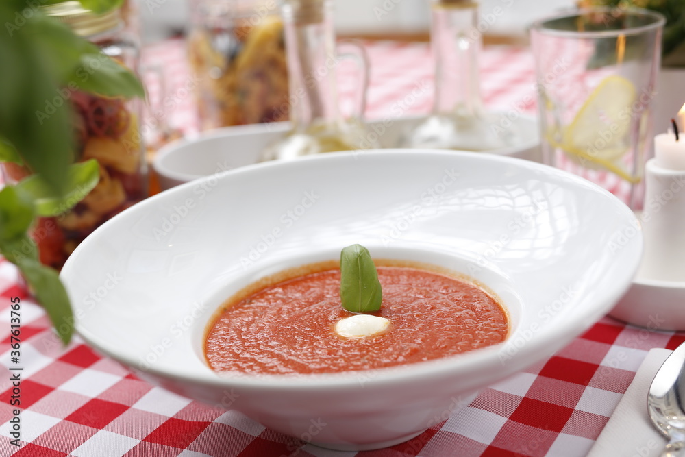 Tomato soup with basil and cream.
Suggestion to serve a dish. Food background.
Tomato soup with basil and cream.
Suggestion to serve a dish. Food background.