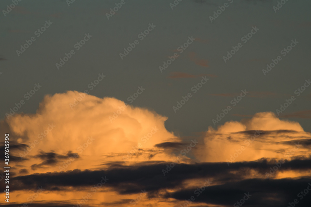 sunset, colorful overcast twilight sky with Cumulus clouds