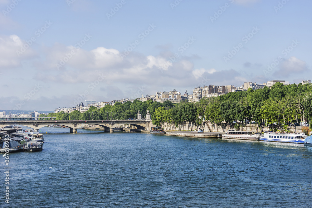 View of Jena Bridge (Pont d'Iena, 1814). Jena Bridge spanning River Seine in Paris, it links Eiffel Tower on the Left Bank to the district of Trocadero on the Right Bank. Paris, France.