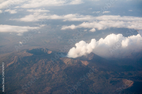 Aerial view of active volcano releasing smoke