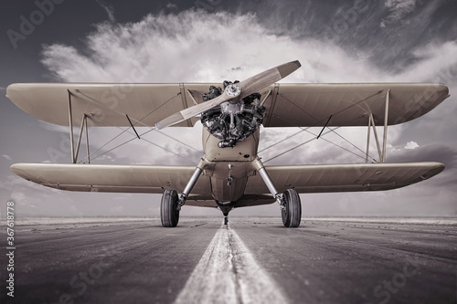 historical biplane on a runway ready for take off