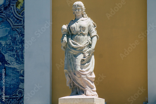 Closeup of the statue front the Carlos Lopes pavilion located in the Eduardo VII park of Lisbon, the hilly coastal capital city of Portugal photo