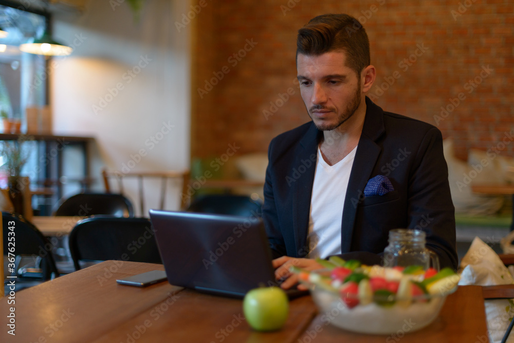 Handsome bearded Hispanic businessman at the coffee shop Handsome bearded Hispanic businessman at the coffee shop