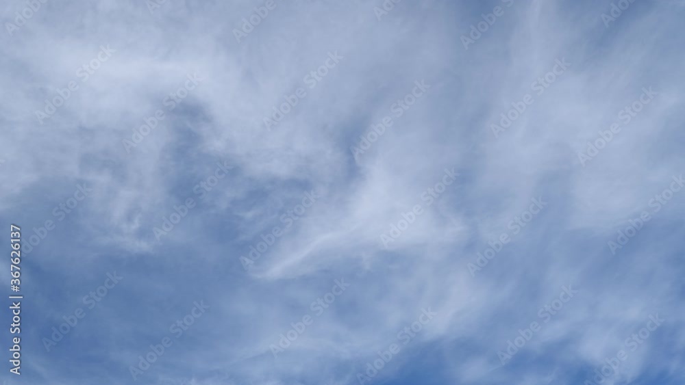 timelapse, white clouds on a blue sky. Unrealistic rapid movement of white clouds in the blue sky. movement of clouds filling the space.