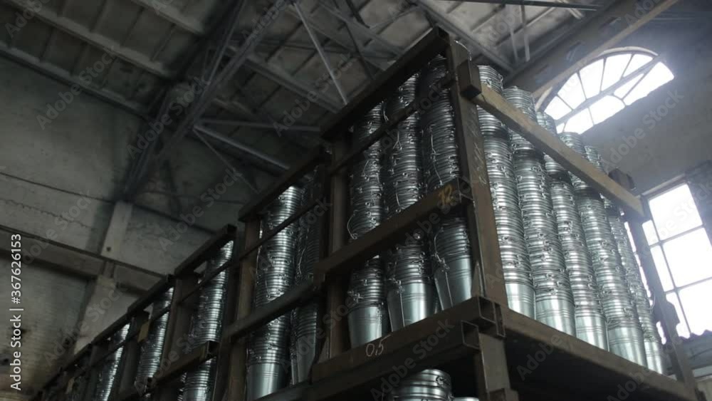 Hard work at the factory. Manufacture of buckets. Shop for the production of household items. Aluminum buckets. Conveyor. Hard work at the factory. Manufacture of buckets. Shop for the production of household items. Aluminum buckets. Conveyor.