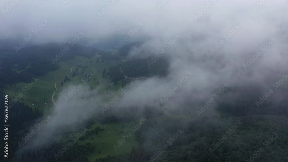 Out from clouds, mountain landscape flight and breathtaking view Out from clouds, mountain landscape flight and breathtaking view