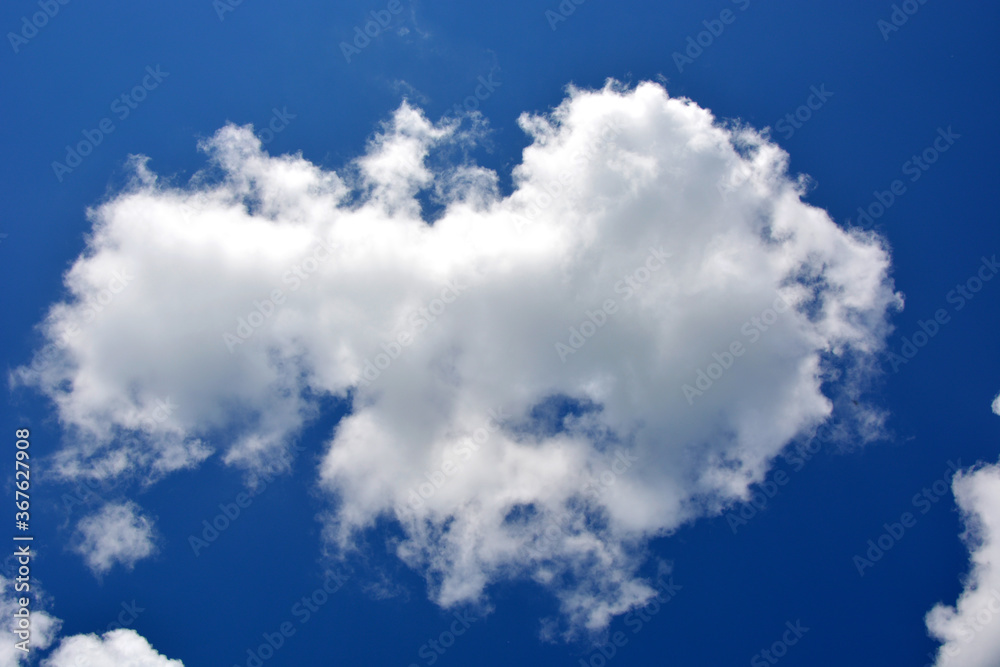 Beautiful white cloud on a blue sky, horizontal photo. Beautiful white cloud on a blue sky, horizontal photo.