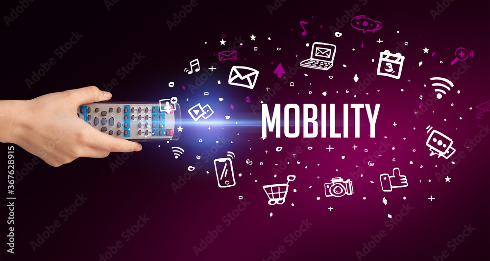 hand holding wireless peripheral with MOBILITY inscription, social media concept hand holding wireless peripheral with MOBILITY inscription, social media concept