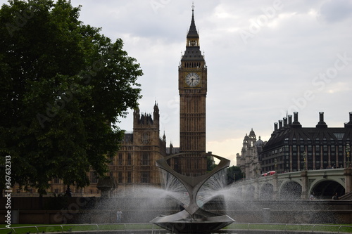 Big Ben in london with the water fountain in the forefront