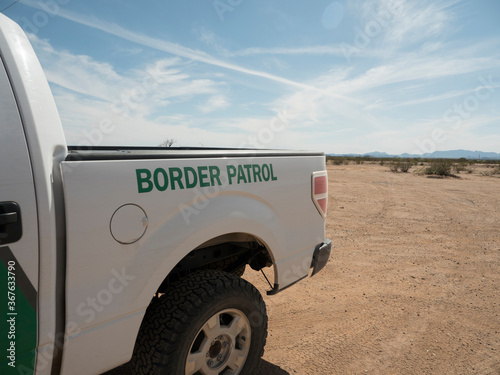 A border patrol truck parked in the desert