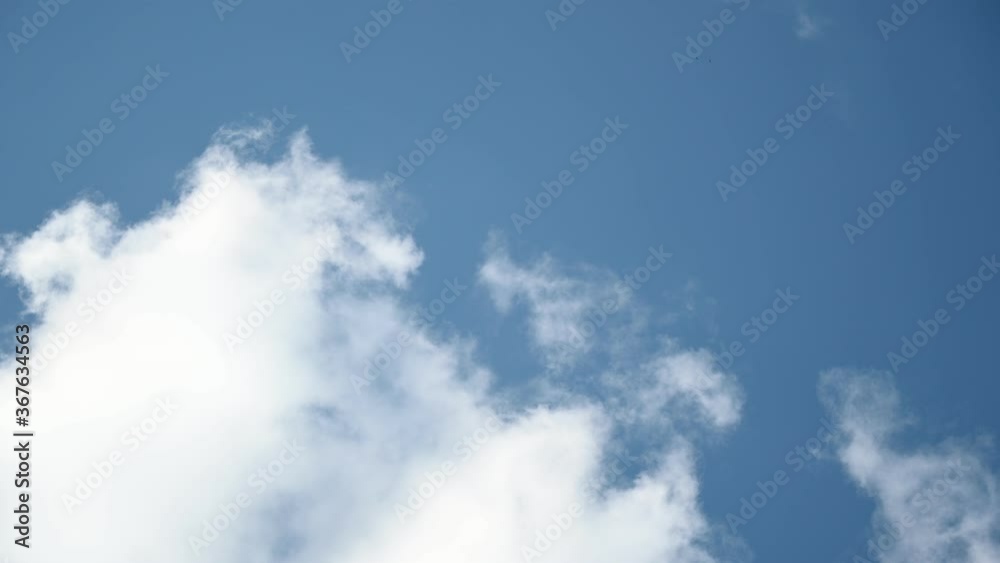 timelapse, white clouds on a blue sky. Unrealistic rapid movement of white clouds in the blue sky. movement of clouds filling the space. timelapse, white clouds on a blue sky. Unrealistic rapid movement of white clouds in the blue sky. movement of clouds filling the space.