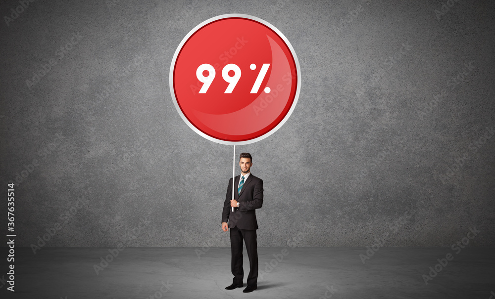 Young business person holdig traffic sign with 99% abbreviation, technology solution concept Young business person holdig traffic sign with 99% abbreviation, technology solution concept