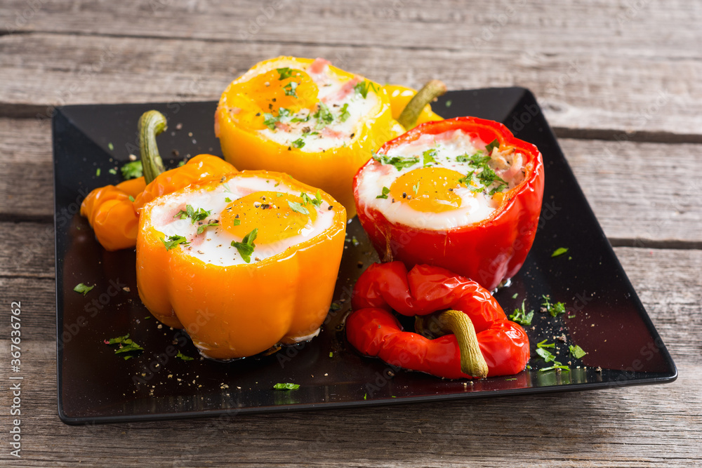 Baked pepper stuffed with bacon and eggs Baked pepper stuffed with bacon and eggs