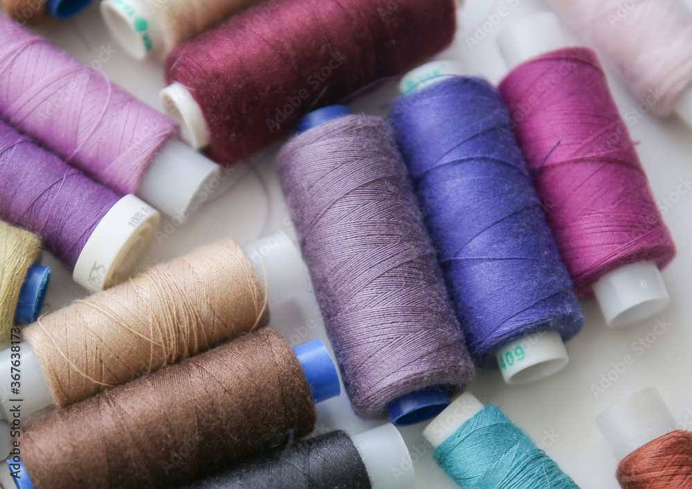 reels of multicolored threads reels of multicolored threads