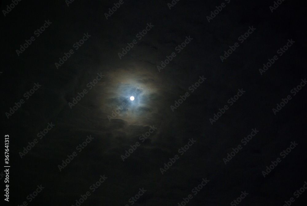 The moon in the night sky. The moon in the night sky.