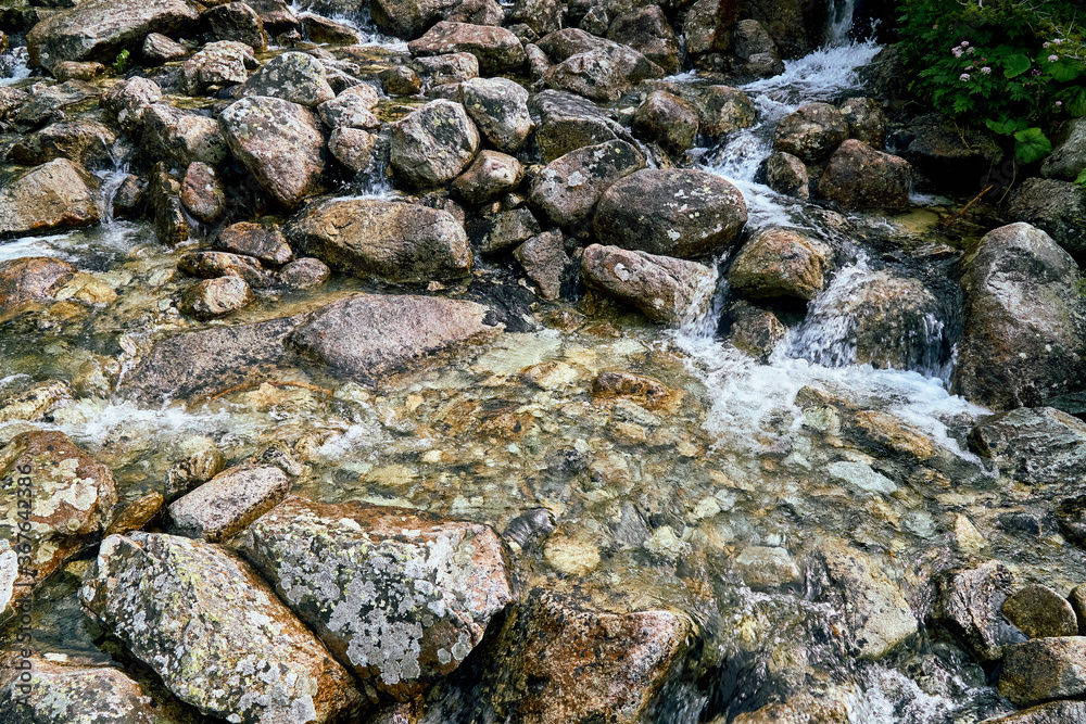 Mountain fresh, cold stream with drinking clean water in High Tatras National Park, Slovakia, Europe. Beautiful world. Mountain fresh, cold stream with drinking clean water in High Tatras National Park, Slovakia, Europe. Beautiful world.