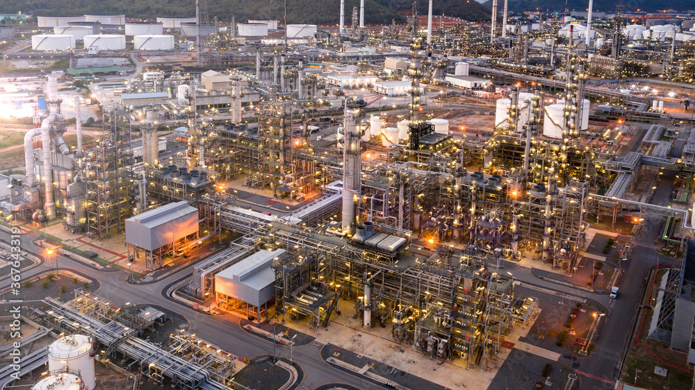 Aerial view of Oil refinery plant in twilight time, Petrochemical industry is important to the global economy.
