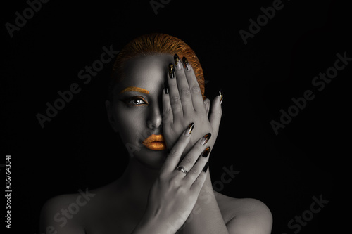 woman with golden makeup in set with nails manicure, eyebrows, hair