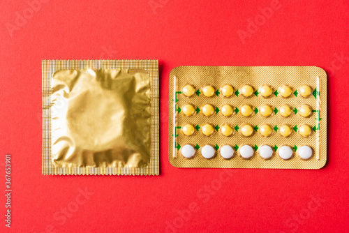 condom on wrapper pack and contraceptive pills blister hormonal birth control pills