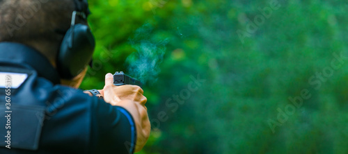 the man shooting with gun