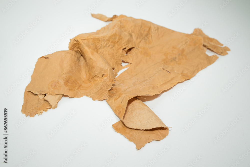 Old grunge paper texture.The texture of the paper is wet, old, yellowed with time. Torn, stained. Old grunge paper texture.The texture of the paper is wet, old, yellowed with time. Torn, stained.