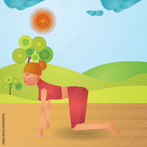 girl practising yoga in cat pose