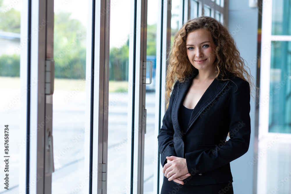 Elegant business caucasian woman at modern office building Elegant business caucasian woman at modern office building