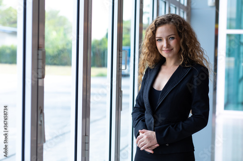 Elegant business caucasian woman at modern office building