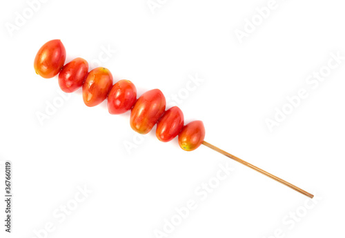 cherry tomato with wood skewer isolated on white background