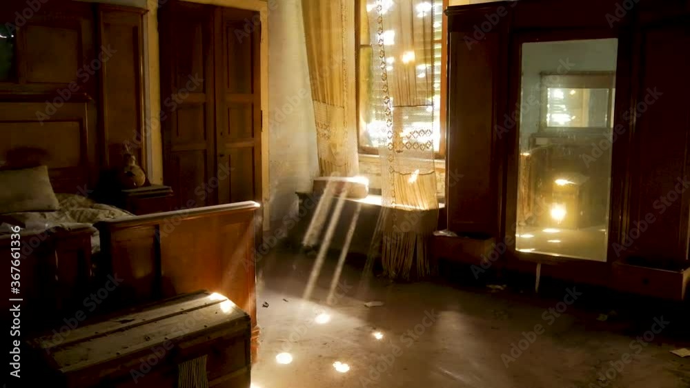 Light rays beam through the bedroom window of an abandoned and disused villa in Northern Italy. Light rays beam through the bedroom window of an abandoned and disused villa in Northern Italy.