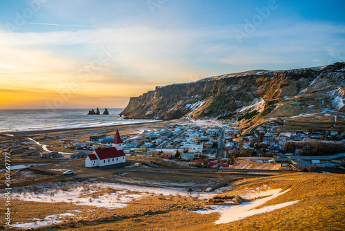 Vik, a small town at the south coast in Iceland, in winter time, at sunset.