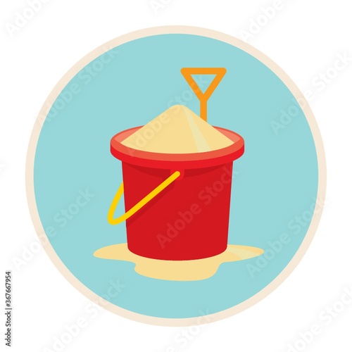 a bucket of sand with shovel