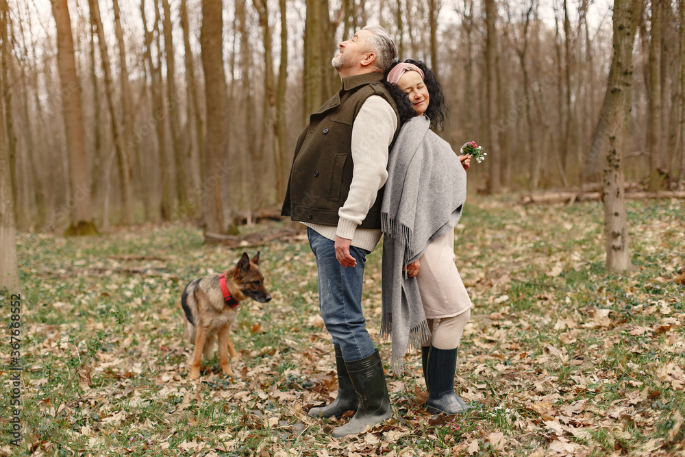 Seniors in a forest. People walks. Family with dog. Seniors in a forest. People walks. Family with dog.