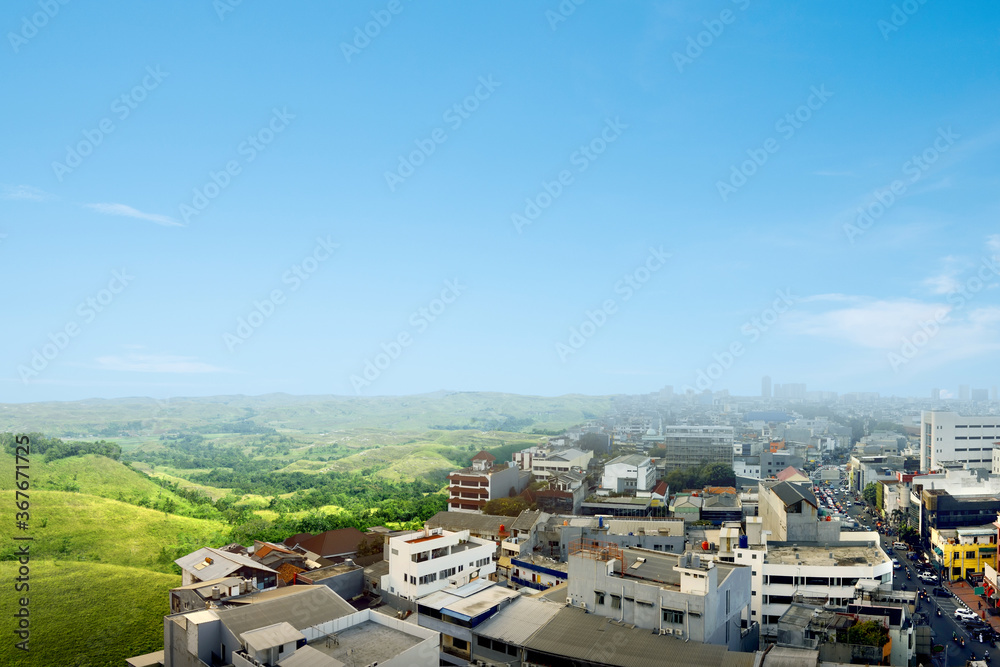 Green landscapes and city with a blue sky background