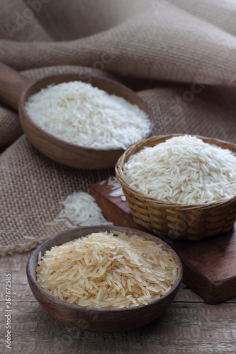 Indian basmati rice variety on a wooden background photo