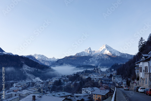 Berchtesgaden and Mountain Watzmann at sunrise in winter with fog in valley