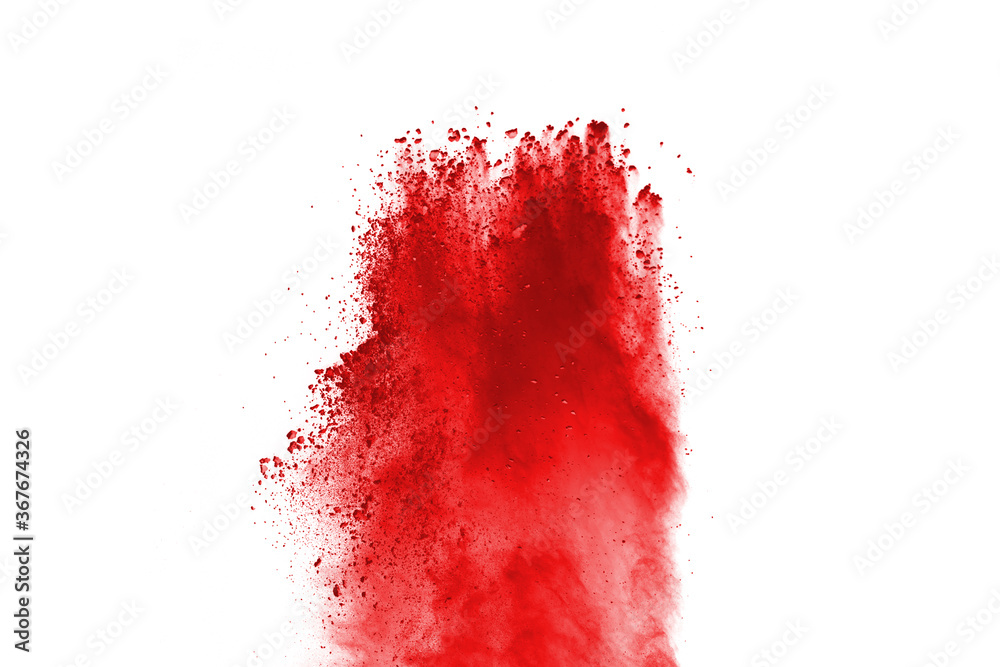 Red powder explosion isolated on white background. Paint Holi.