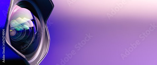 Fotografie .Banner. The camera lens with purple backlight. Optics. Technological background