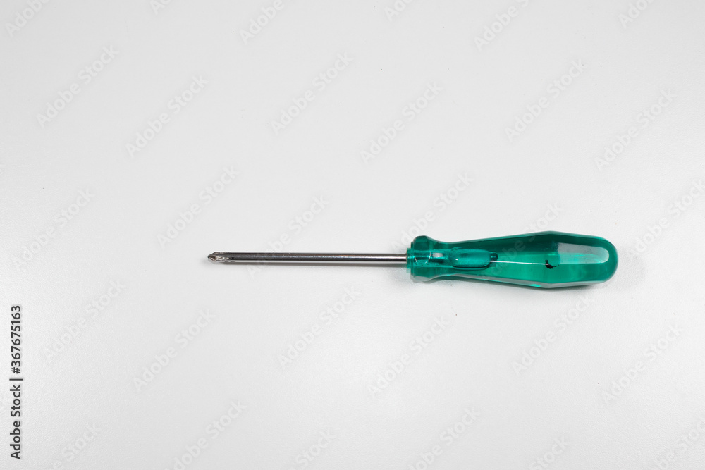 A typical Phillips screwdriver has a collored handle and on white background, clipping path A typical Phillips screwdriver has a collored handle and on white background, clipping path
