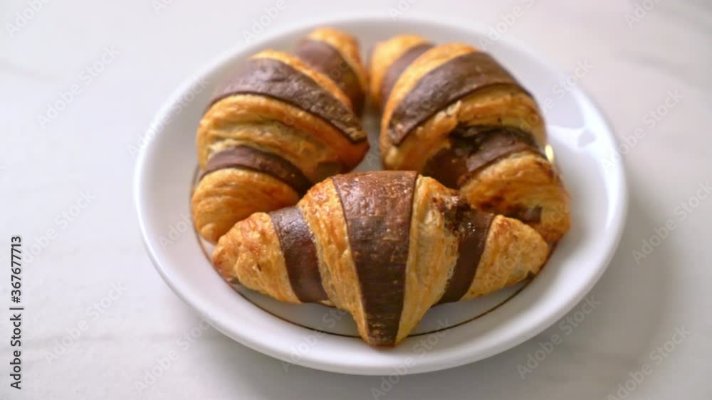 fresh croissant with chocolate on plate fresh croissant with chocolate on plate