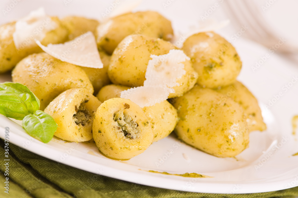 Potato gnocchi stuffed with pesto sauce. Potato gnocchi stuffed with pesto sauce.