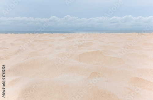 Beautiful white sandy tropical beach with ocean and white cloud.